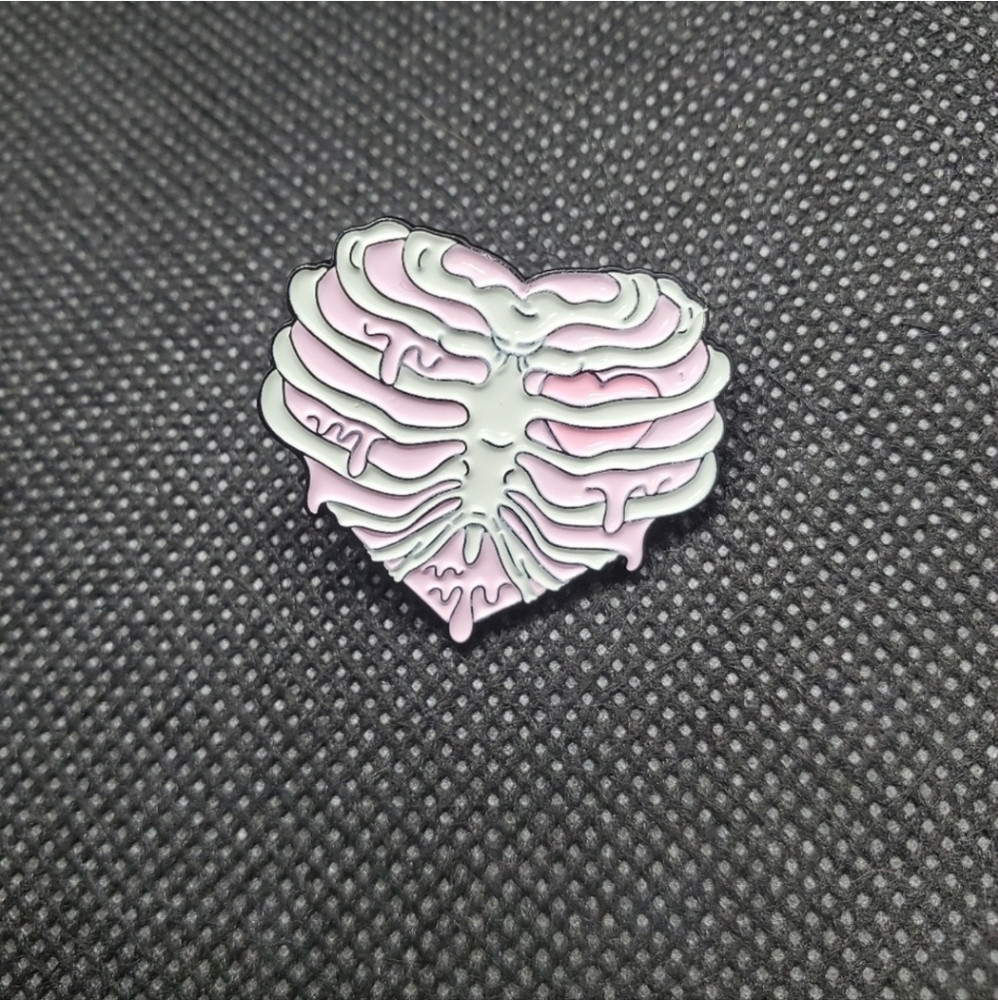 skeleton rib cage heart enamel pin